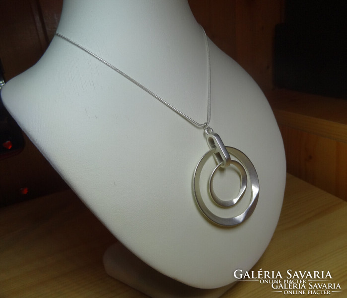 Very nice matte silver long necklace with a special pendant.