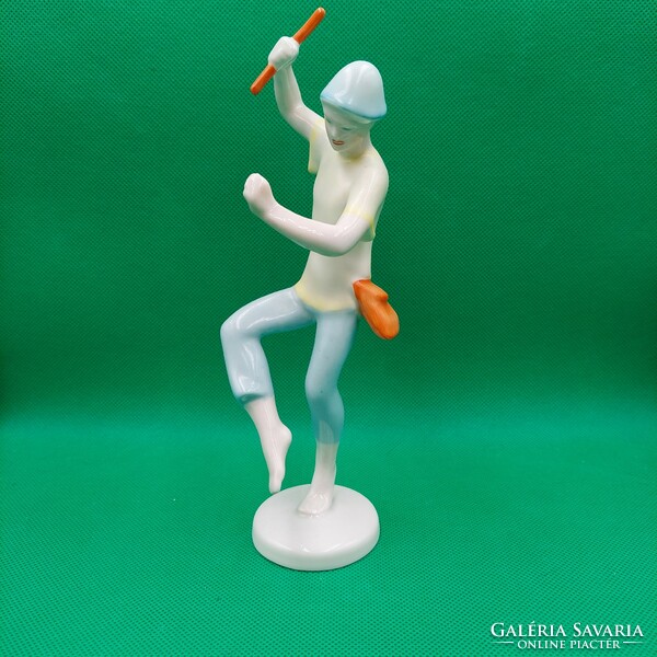 Figure of a boy dancing with a raven house stick