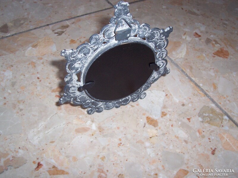 A small framed mirror in good condition