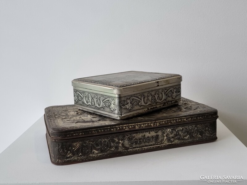 Old patinated embossed metal biscuit boxes
