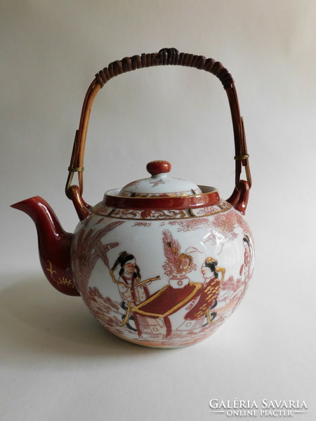 Old Japanese tea pot with bamboo handle