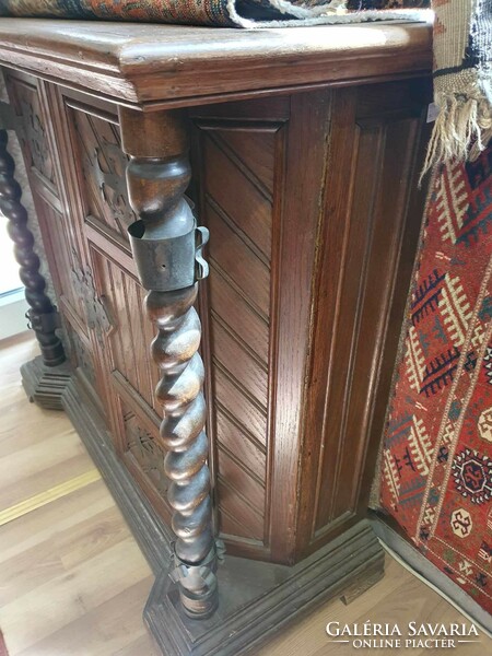 Antique Flemish sideboard with wrought iron hinges. With beautiful hand carvings.