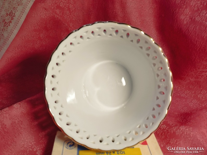 An openwork porcelain bowl with an angelic pattern