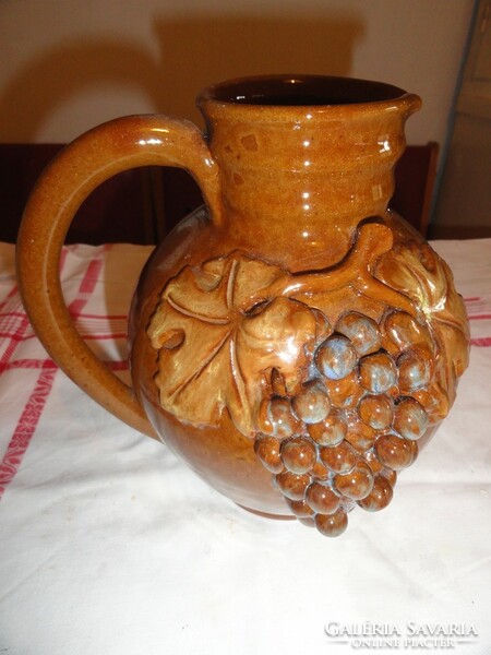Ceramic wine jug with grape decoration
