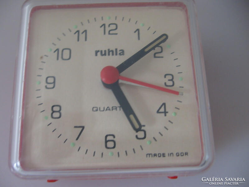 Retro dusty cloth alarm clock in need of repair