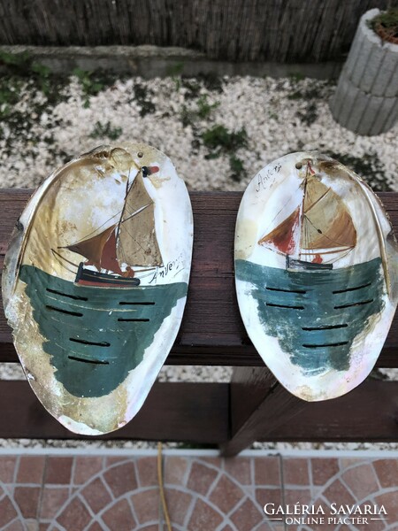 A sailing ship painted on a shell.