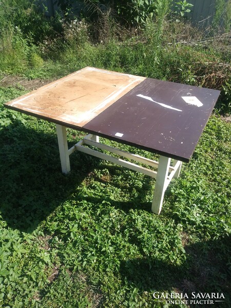 Openable, kitchen table with built-in kneading board