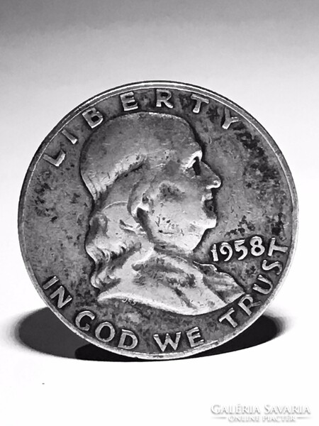 1958 sterling silver dollar with patina in good condition