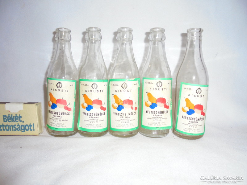 Five old, half-decid, glass bottles with labels, brandy bottles - together - mixed fruit
