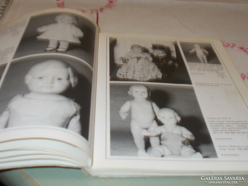 Old baby books about porcelain-headed dolls, celluloid and pulp dolls