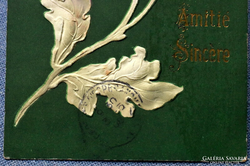 Antique art nouveau embossed litho greeting card with a stylized flower