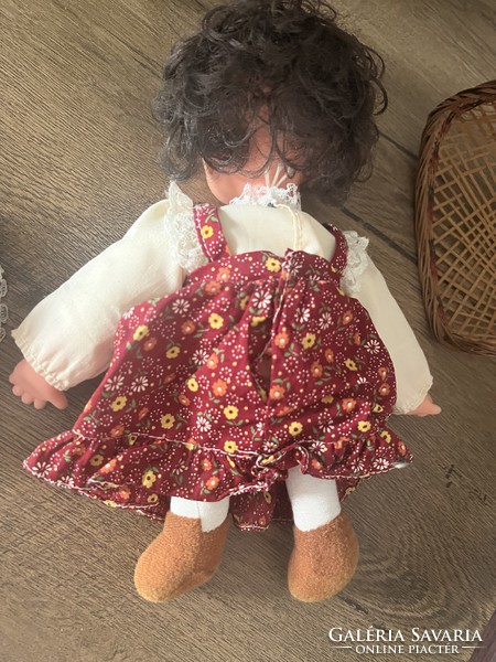 Charming twinkling doll in a hanging basket