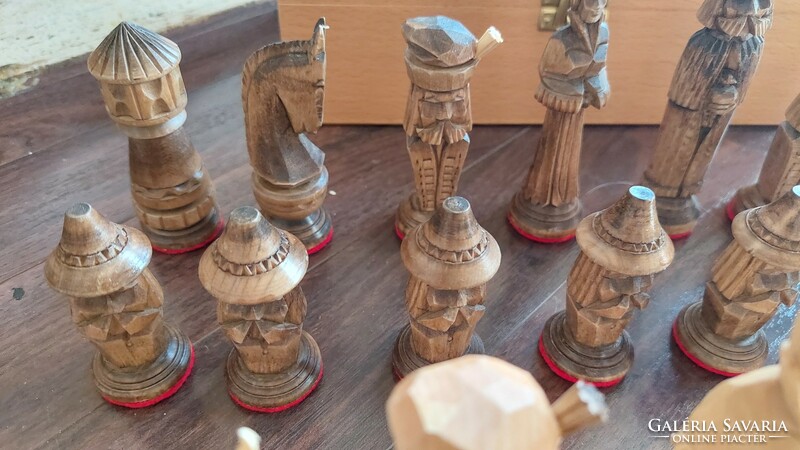Carved human figure chess set