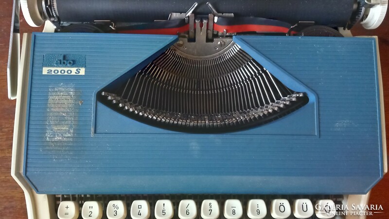 Retro mechanical typewriter Portuguese blue