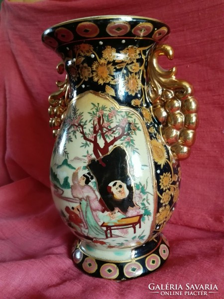 An old, hand-painted, richly decorated porcelain vase....Oriental.