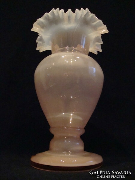 A dreamy glass vase with a frilled top, flawless