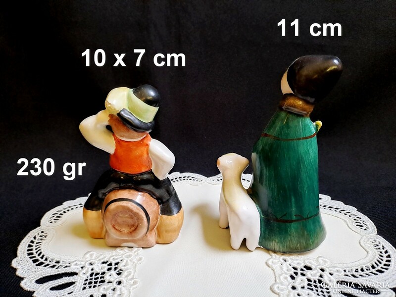 Bodrogkeresztúr pottery with a boy in a hat sitting on a wine barrel and a shepherd lamb