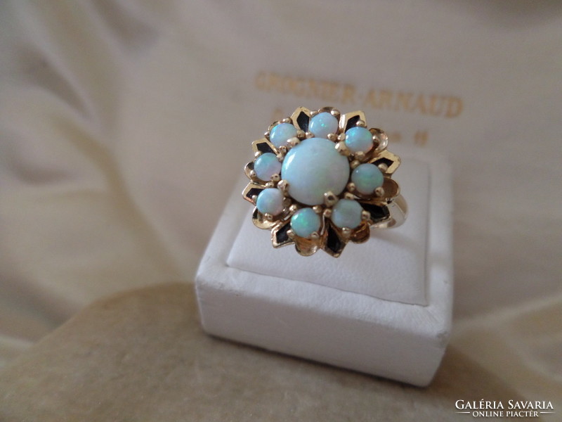 Gold cocktail ring with genuine opals and black enamel