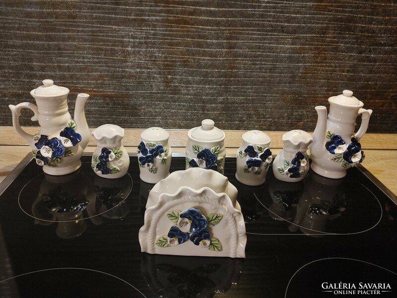 Showy blue pansy spice napkin and oil holders made of porcelain