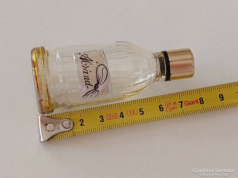 Old-fashioned perfume glass cologne bottle with vintage label