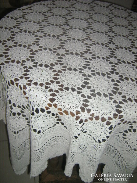 Hand-crocheted tablecloth with antique snow-white Art Nouveau features