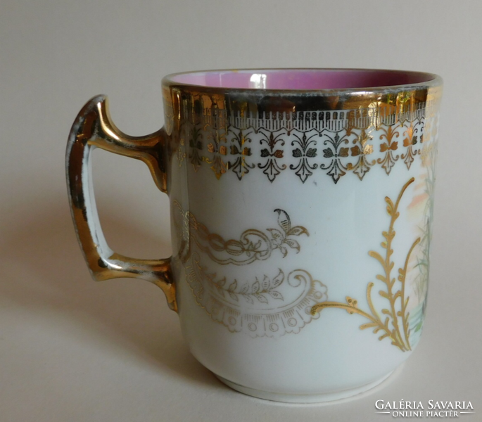 Antique mug with putty decoration