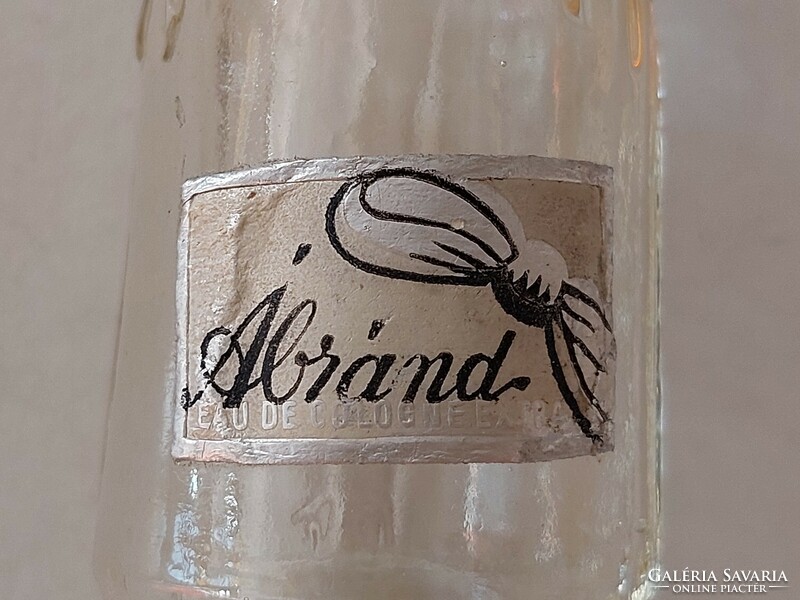 Old-fashioned perfume glass cologne bottle with vintage label