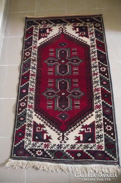 Persian rug with a kazakh pattern.
