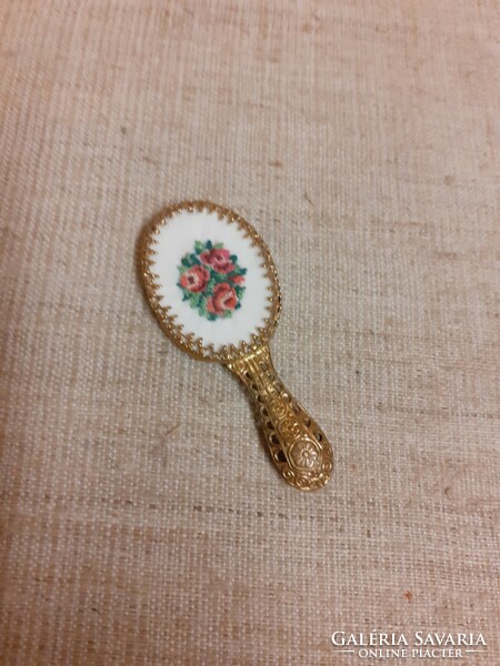 Small mirror with filigree handle decorated with old tapestry