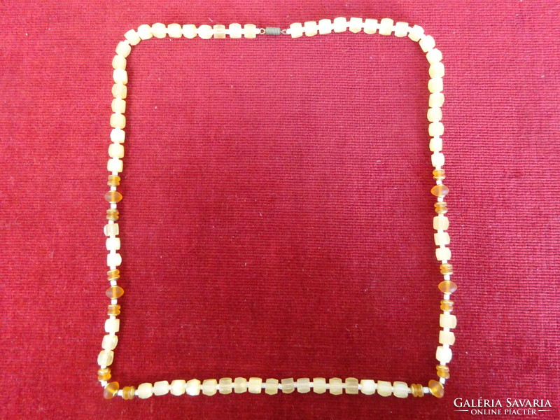 Cream-colored bijou necklace, length 72 cm. Jokai