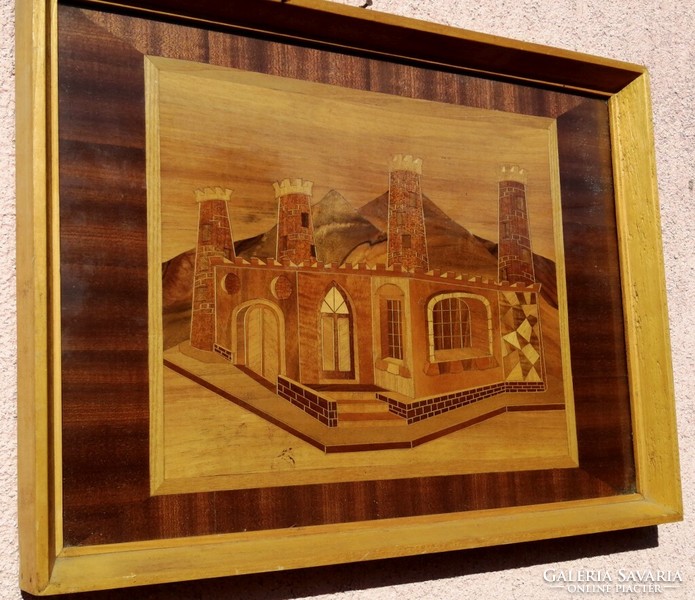 Arab fortress among the sand dunes. Intarsia table picture in glazed framing