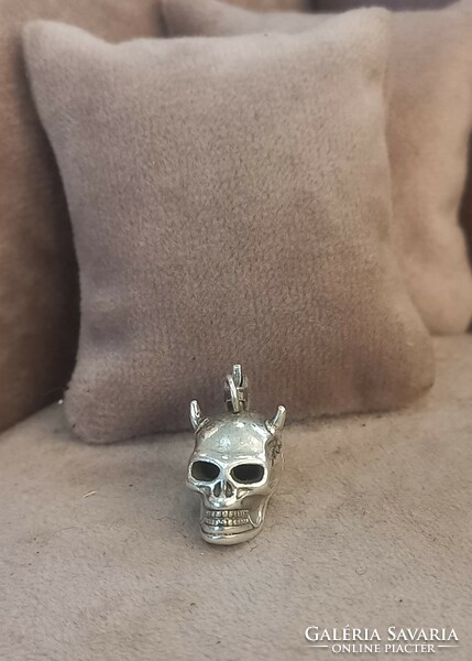Silver charm skull
