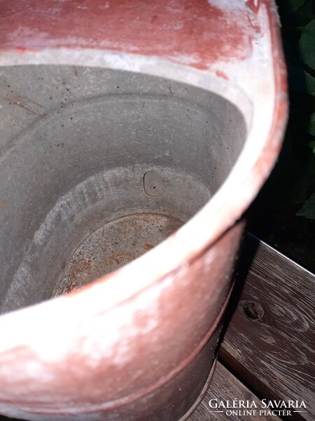 Found an antique tin watering can in used condition - more like a decoration