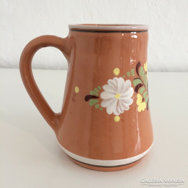 Glazed folk ceramic jug with flower pattern