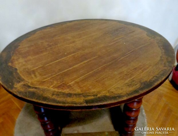 Antique imposing massive round table with copper decoration