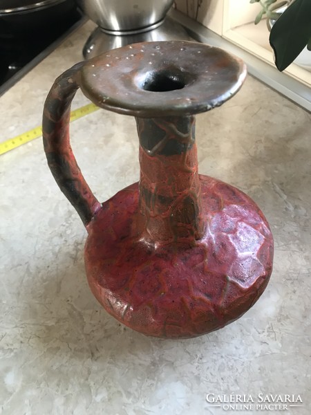 A vase or candle holder made by an artisan in good condition
