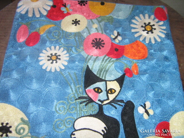 Light blue velvet decorative pillow with a kitten embroidered in a beautiful material