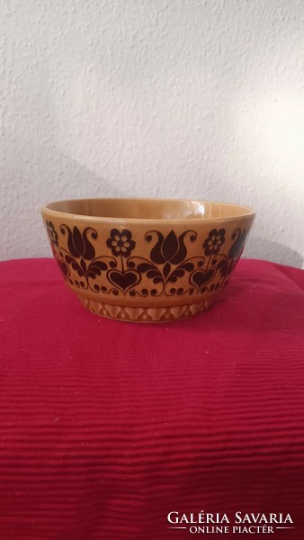 A vintage ceramic bowl with a flower pattern in beautiful condition.