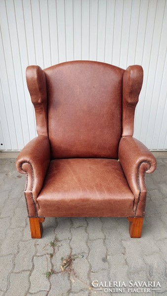 Large leather armchair with ears