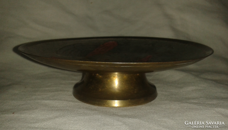 Copper bowl with a painted flower pattern