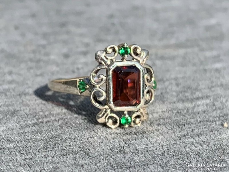 Women's silver ring with red and green stones