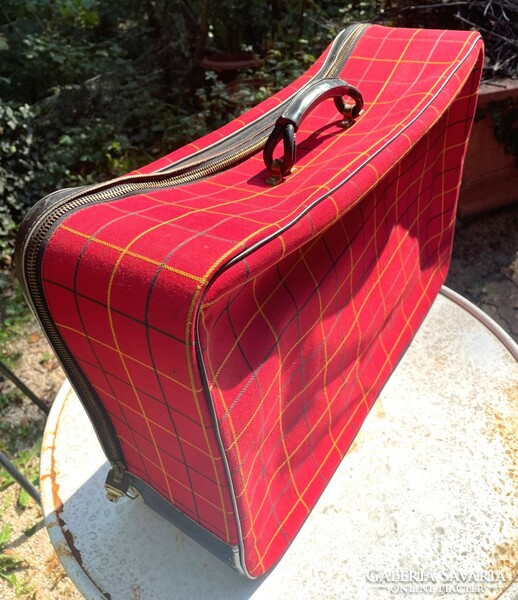 Red checkered fabric, old vintage suitcase with black zipper on the side, retro suitcase - Christmas decoration