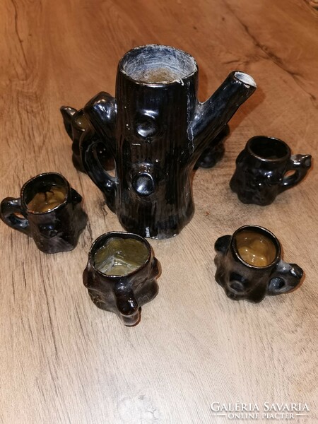 Ceramic brandy set in the shape of a tree trunk.