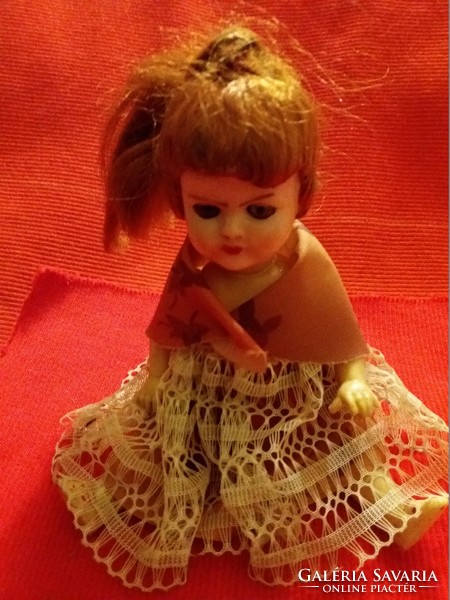 Antique celluloid hair glass eyes sleeper-blinking hair plantable doll in the condition shown in the pictures
