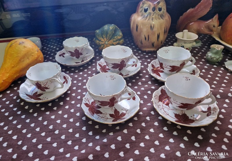 A wonderful set of mocha coffee cups from aquincum porcelain with a brown leaf pattern in autumn decor.