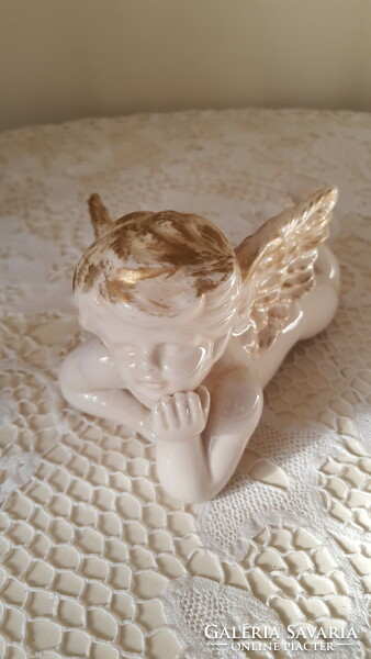 Heavy gilded porcelain, lying angel face 20 cm.