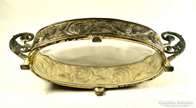 XX. No. The front has a beautiful antique patina silver-plated rose patterned glass tray