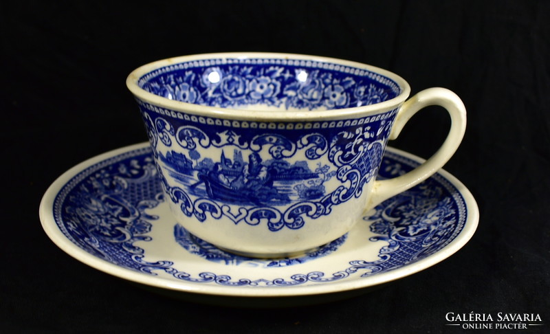 XX. No. The first half is an English faience tea cup