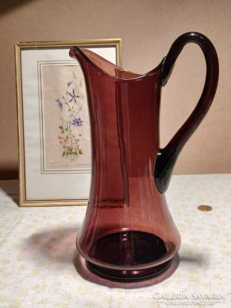 A large purple water jug colored in its material