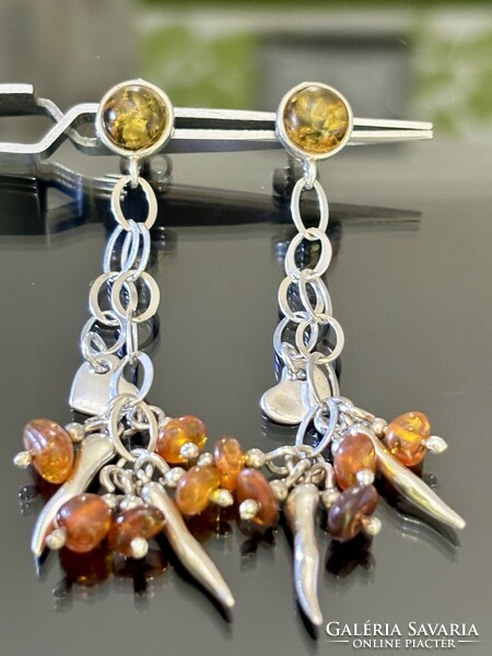 A pair of extreme silver earrings with amber decoration